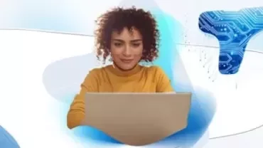 Woman at computer with Talent Trends backdrop